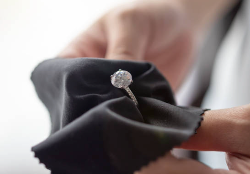 polishing cloth on tarnished silver ring
