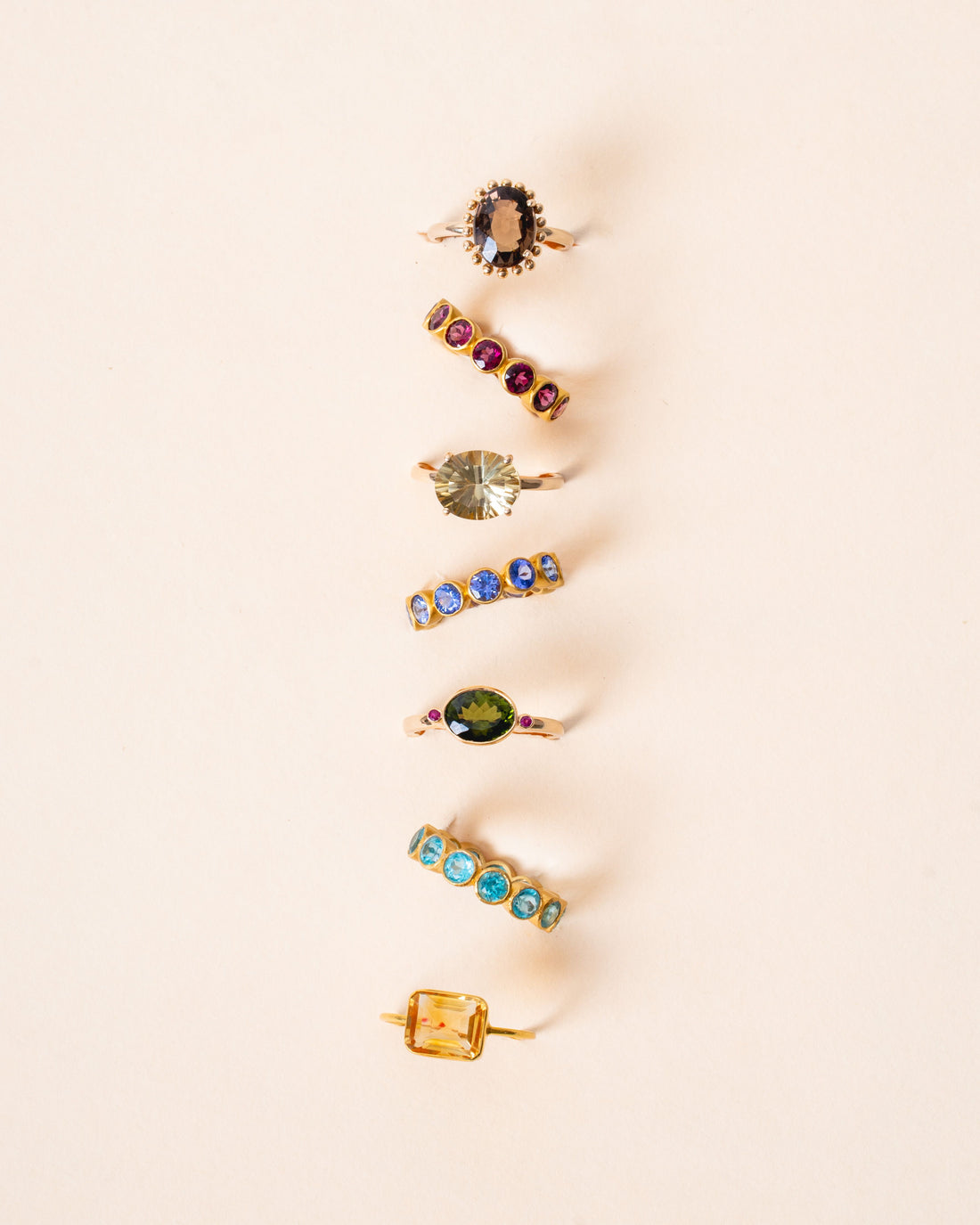minimalist birthstone necklace layered with gold chain